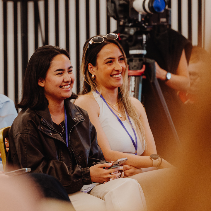 Two people listening intently to the podcast being recorded